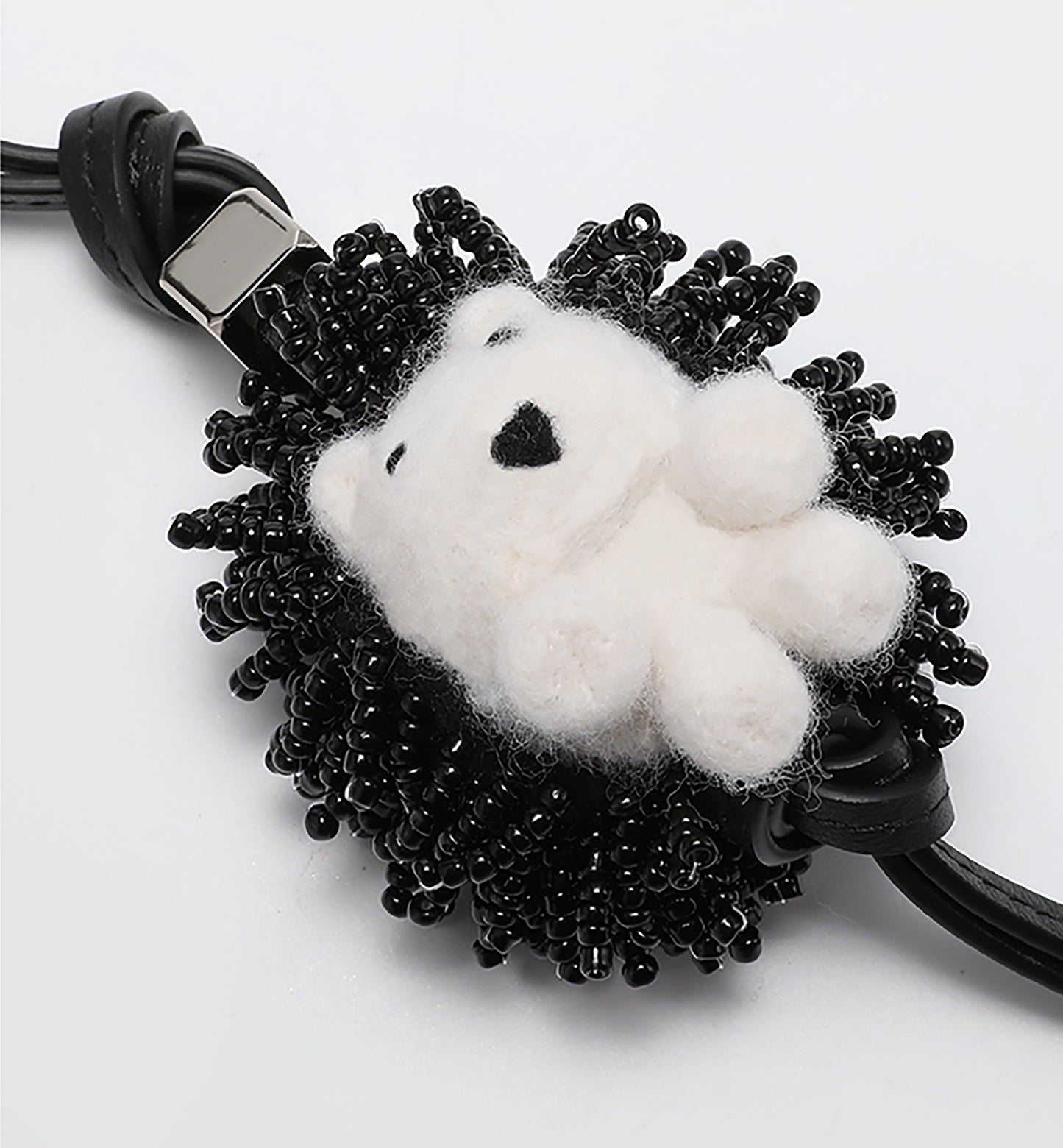 A fashionable handbag charm, handmade from genuine leather, featuring a cute animal design. It can be used as a keychain or a car accessory