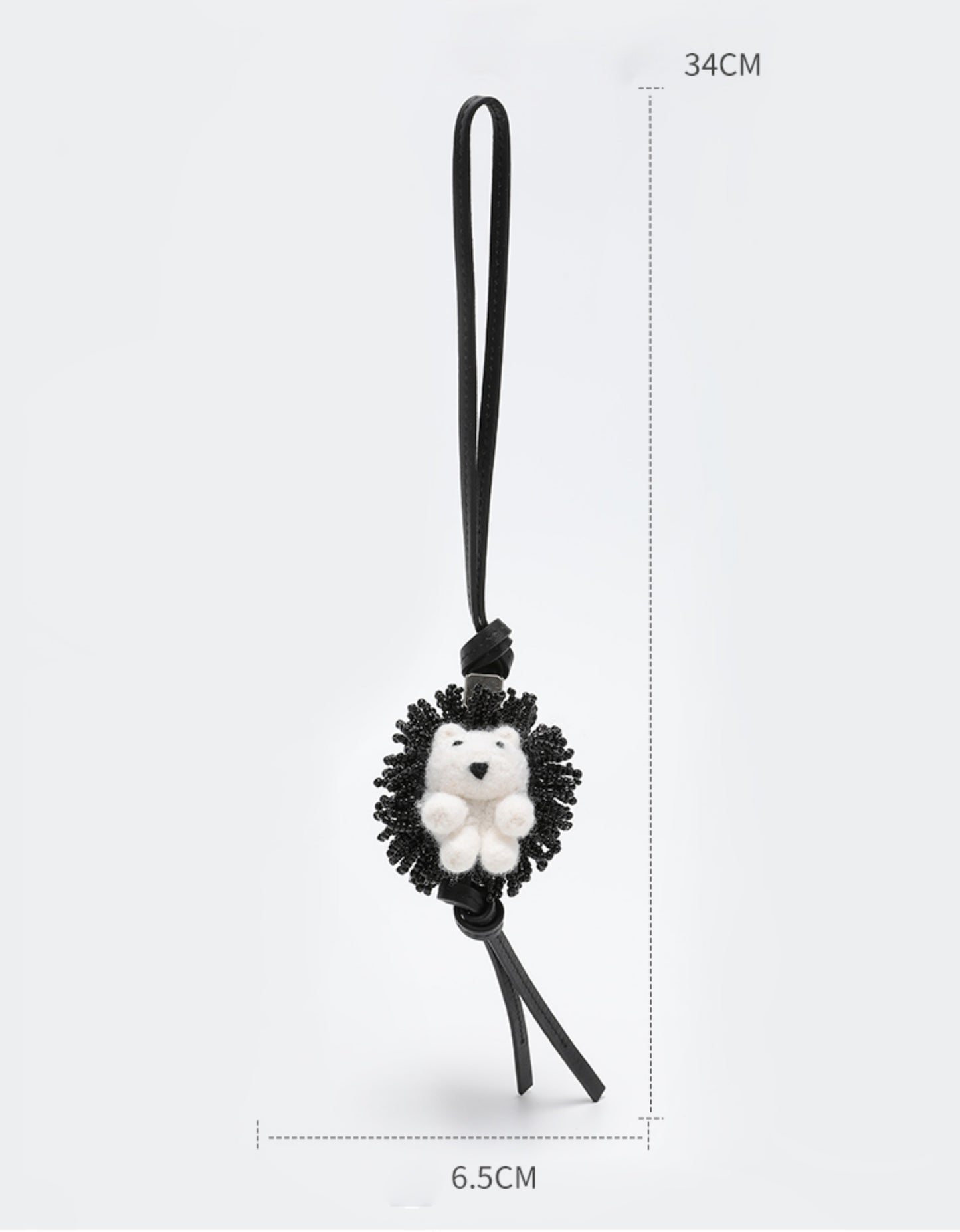 A fashionable handbag charm, handmade from genuine leather, featuring a cute animal design. It can be used as a keychain or a car accessory