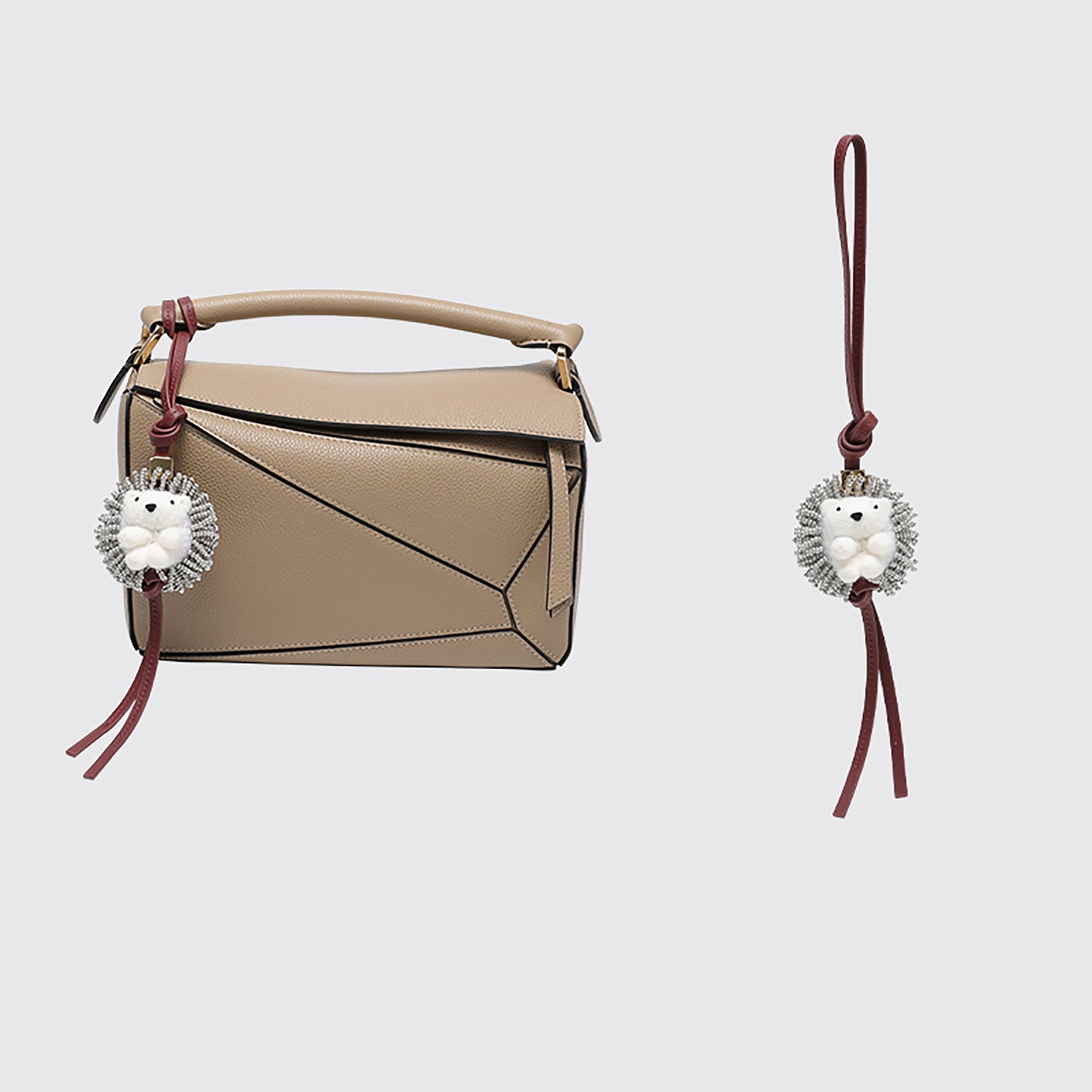 A fashionable handbag charm, handmade from genuine leather, featuring a cute animal design. It can be used as a keychain or a car accessory