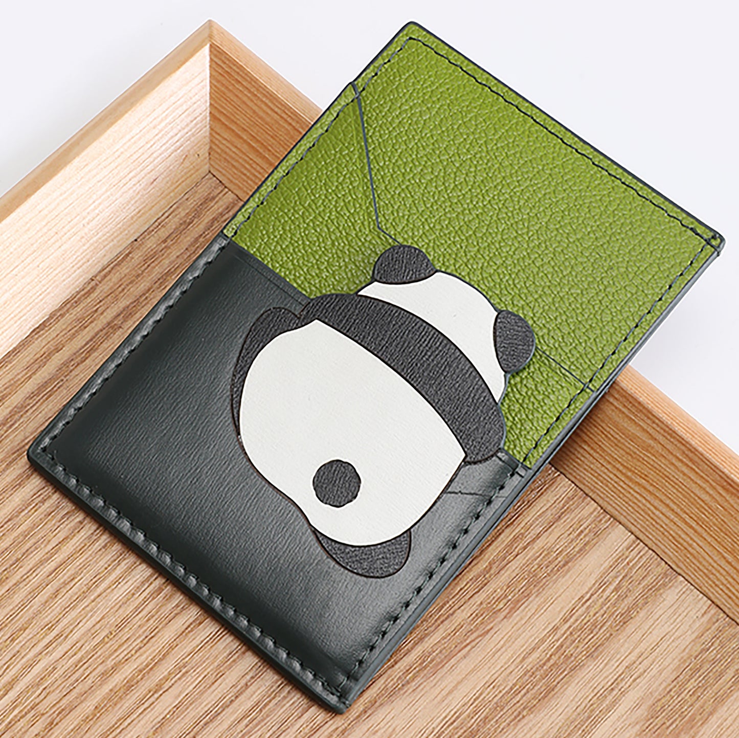 The card holder wallet with multiple card slots, made of genuine leather, integrated design, large capacity, ultra-thin, compact, and portable document organizer.