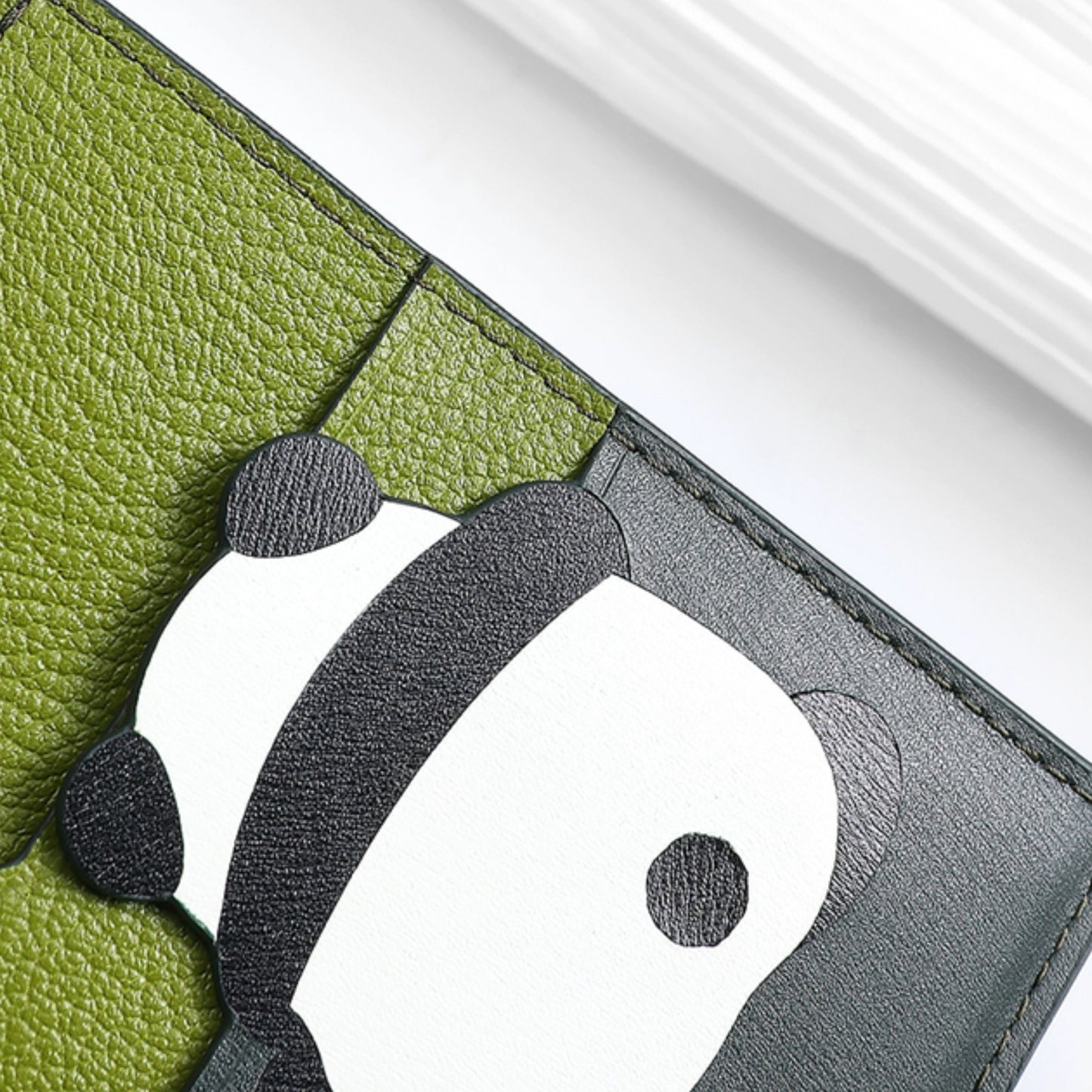 The card holder wallet with multiple card slots, made of genuine leather, integrated design, large capacity, ultra-thin, compact, and portable document organizer.