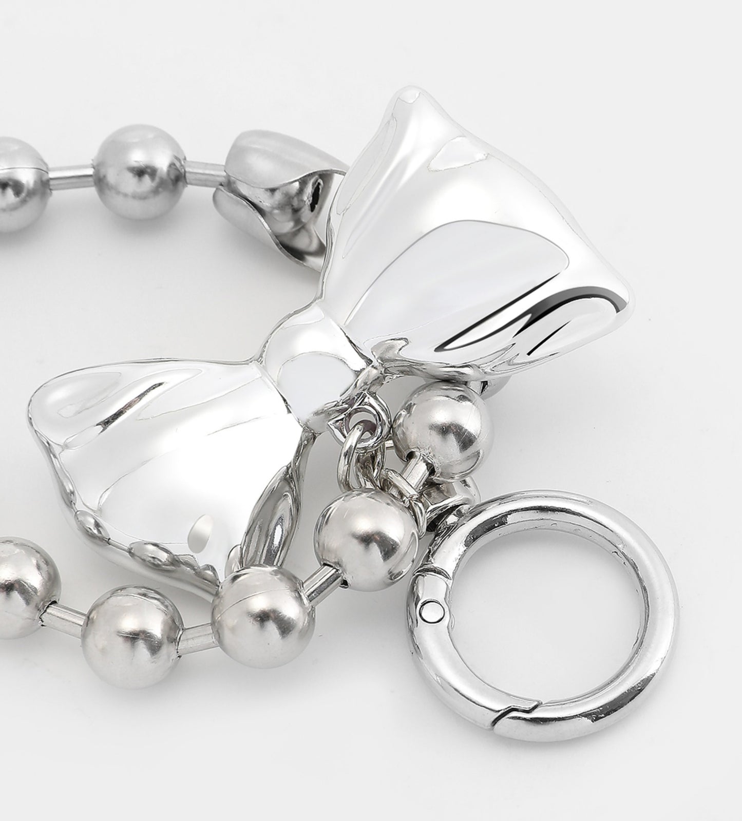 Arcadie leather bag charm, silver bow bag decoration, metal heart-shaped bead keychain