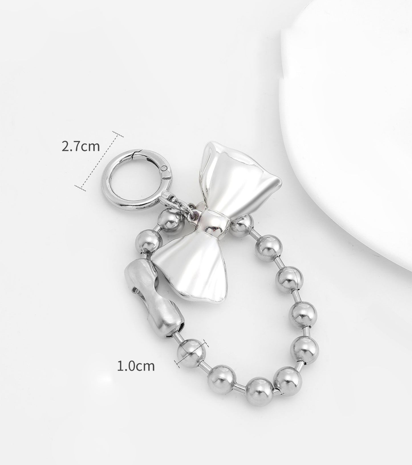 Arcadie leather bag charm, silver bow bag decoration, metal heart-shaped bead keychain